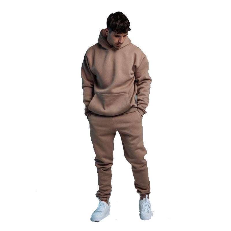 Man wearing a beige hoodie two-piece set with joggers and white sneakers, casual and comfortable style