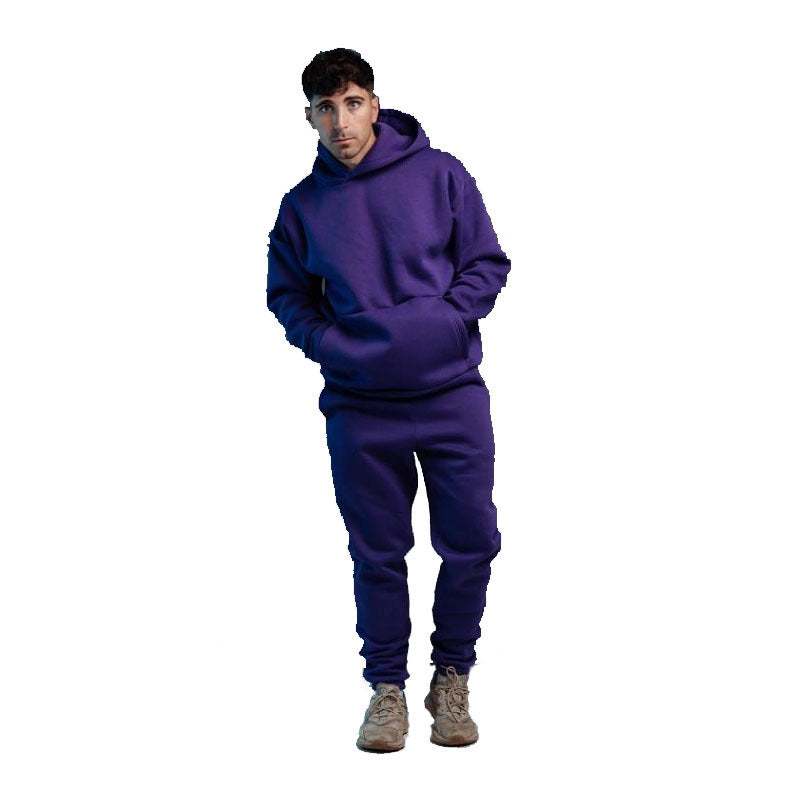 Man wearing a purple hoodie two-piece set with joggers and sneakers, casual streetwear style