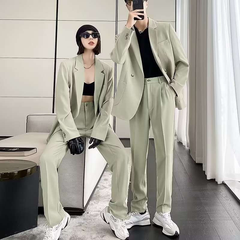 Two models wearing men's casual draping suits in apricot with long sleeves and straight hem design.