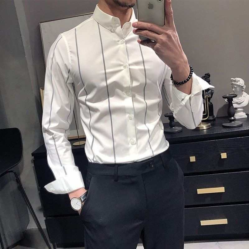 Men's striped British-style slim-fit long-sleeved white shirt with black vertical stripes worn with black pants