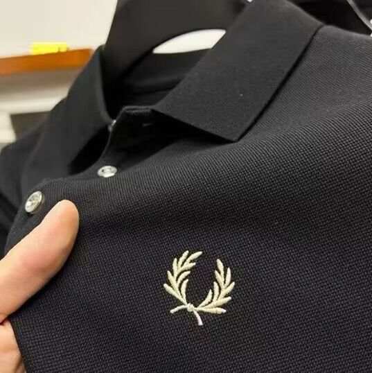 Men's black lapel half sleeve polo shirt with embroidered logo and button-up collar