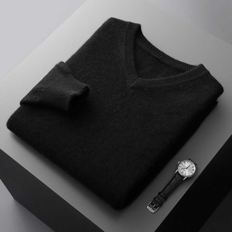 Black V-neck business casual undershirt for men folded neatly next to a black leather strap wristwatch.