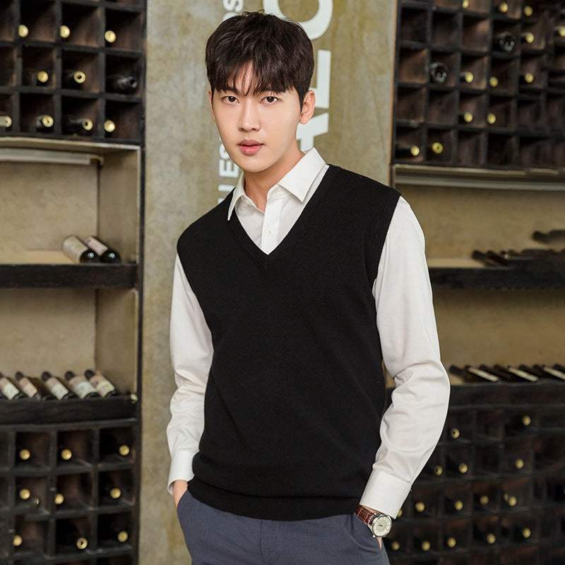 Man wearing black Mens Vest Pullover over white shirt in casual indoor setting