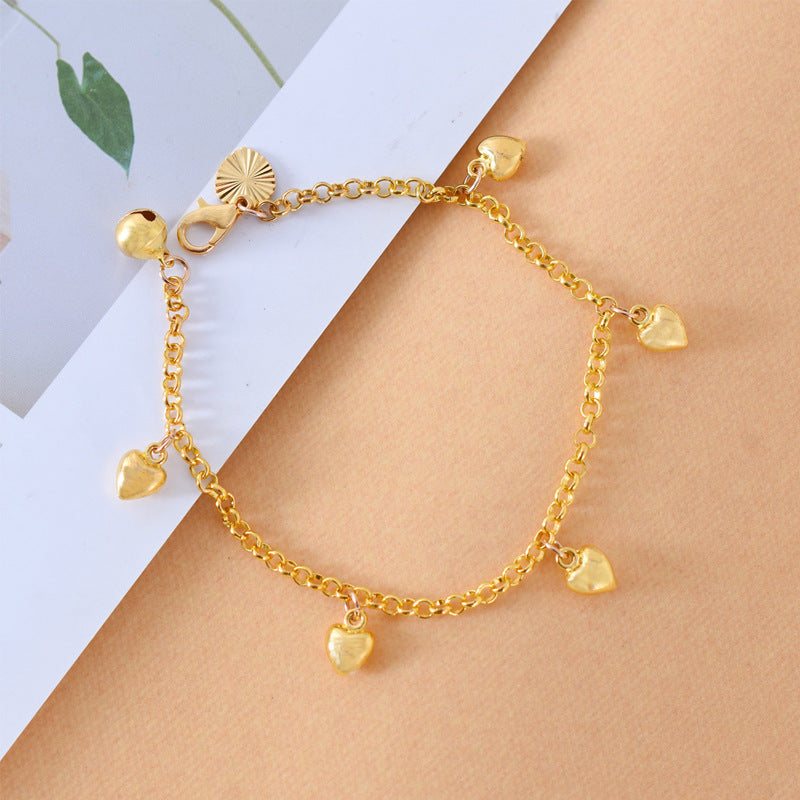Elegant Heart Bracelet with gold chain and multiple small heart charms, stylish and versatile women's fashion jewelry accessory