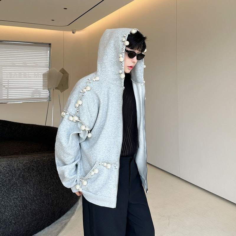 Gray handmade pearl decorated hooded cardigan sweater worn by a man with sunglasses in a modern indoor setting