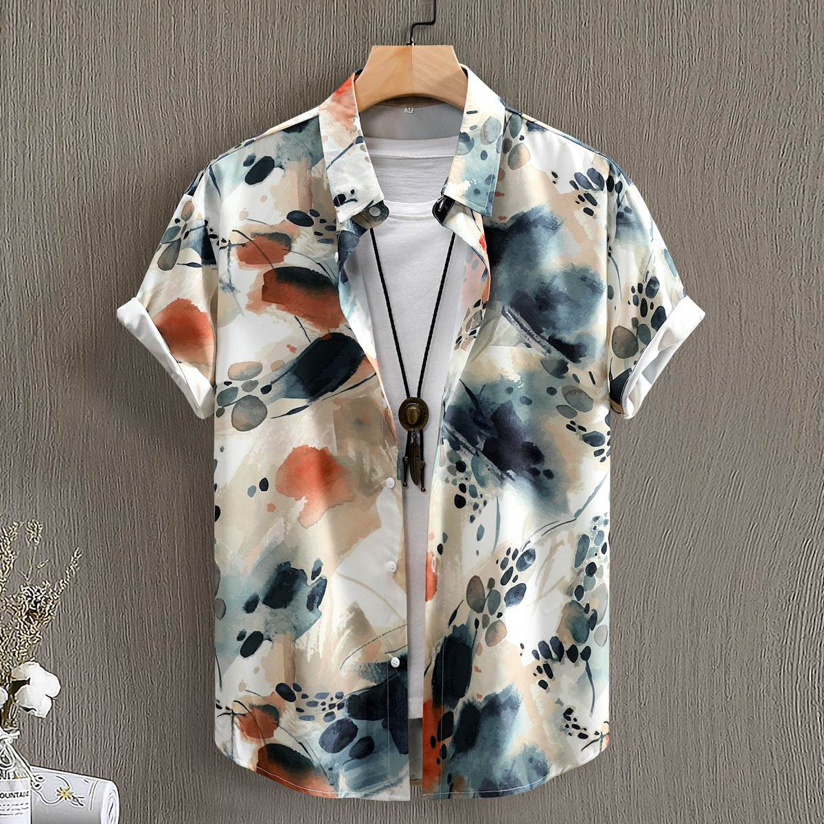 Fashion digital printing men's short sleeve shirt with abstract floral pattern in neutral and blue tones.