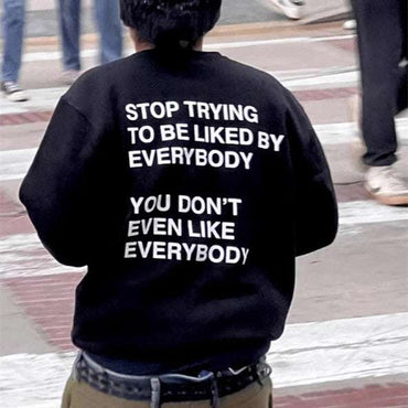 Men's and Women's black sweatshirt with bold white slogan print and drawstring hood, casual unisex style for everyday wear