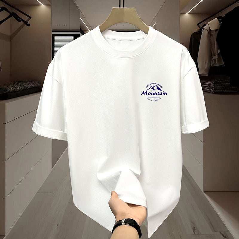 White men's ice silk short sleeve top with mountain print design hanging in closet